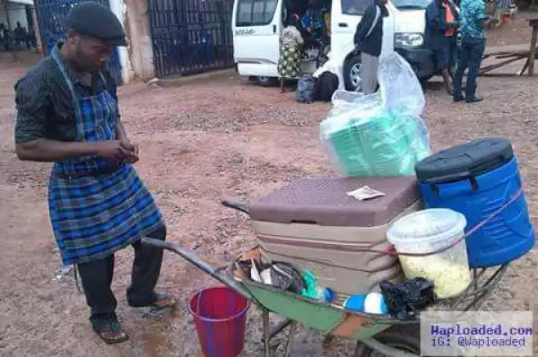See Photos Of A Nigerian Graduate Selling Food In A Wheelbarrow Which Has Gone Viral